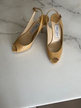 Jimmy Choo peep-toe slingback pumps.